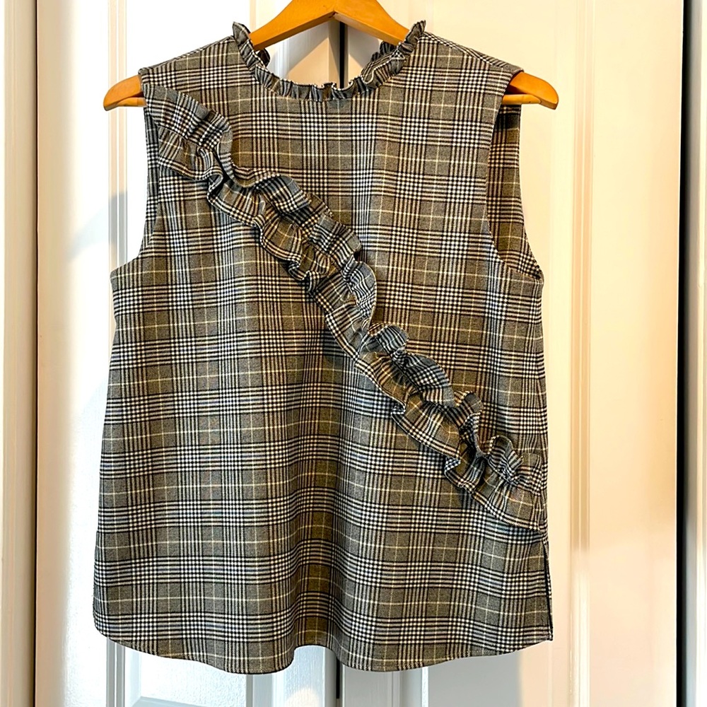 Black and White Plaid sleeveless top with ruffle details.